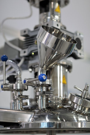Stainless steel chemical equipment closeup. Selective focus.の写真素材