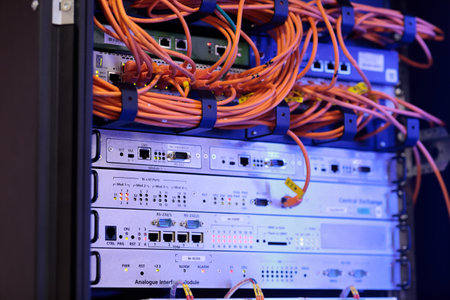 Digital industrial communication equipment in indoor telecom cabinet. Selective focus.