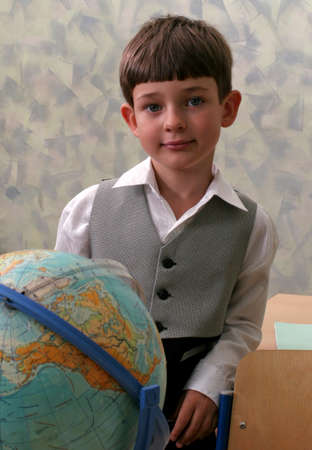 Portrait of the schoolboy with the globeの写真素材