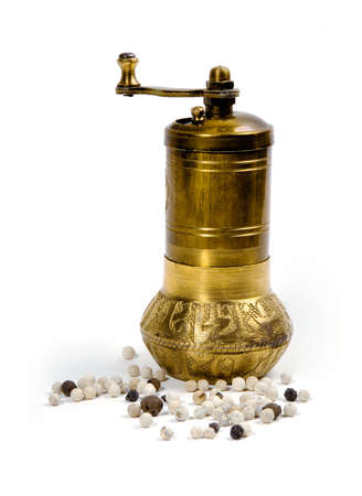Metal pepper mill and  peppercorn isolated on white background.の写真素材