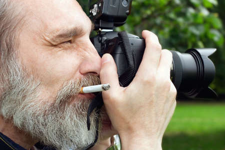 Photographer taking a shoot with a digital cameraの写真素材