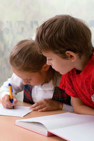 School children sitting at classroom.