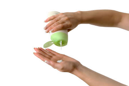 Lotion for body in female handsの写真素材