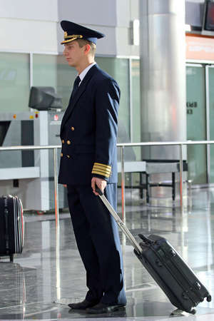 Air  steward in a uniform at the airport