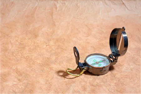 Compass on old  rough paper with empty place for your text. Travel or vacation concept