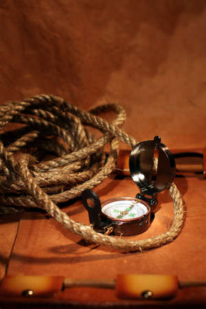 Still-life with  compass, rope and leather roll over old paper. Travel or vacation conceptの写真素材