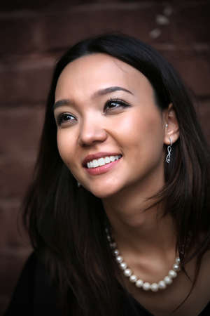A shot of a beautiful asian woman outdoor
