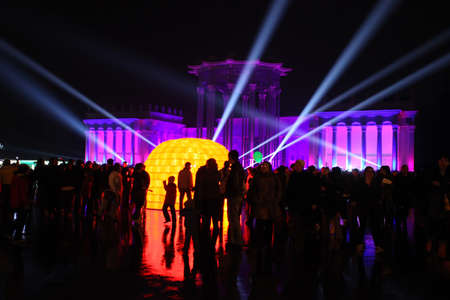MOSCOW - OCTOBER 12: Illumination of the building at an exhibition (VDNH) during the International festival Circle of Light on october 12, 2014 in Moscow, Russia. Game of rays of light  affects the main attractions of the city.のeditorial素材