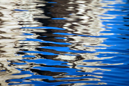 Abstraction on water surface. Patches of light and reflectionsの写真素材