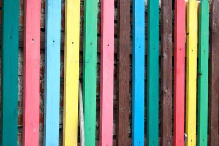Fence from multi-coloured timber planks. Backgroundの写真素材