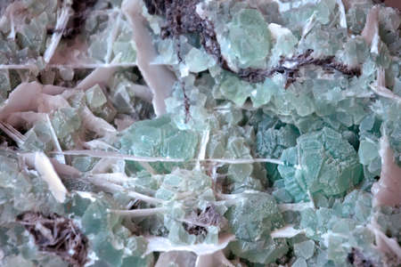 Fluorite mineral crystals close-up. background