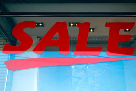 Red Sign of sale shopping  on a show-window of shopの写真素材