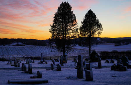 Cemetery Sunset in Norwayの写真素材