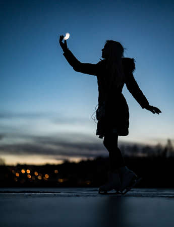 Girl Ice Skating in Norwayの写真素材