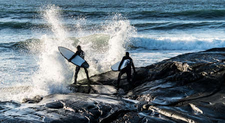 Surfing in Norway during winter timeの写真素材