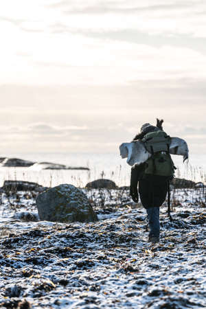 Girl outdoor with her pet in Norwayの写真素材