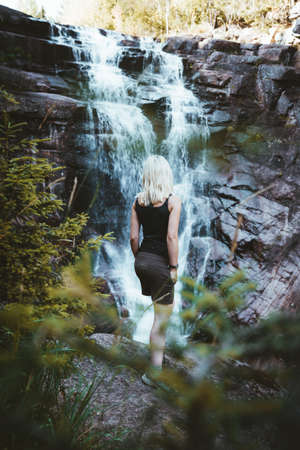 A girl hiking at the Solbergelva river in south Norwayの写真素材