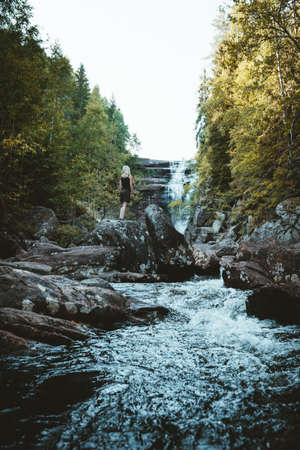 A girl hiking at the Solbergelva river in south Norway