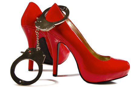 Handcuffs and high heelsの写真素材