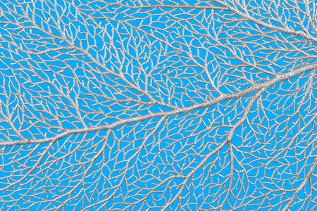 Abstract silver leaf texture on blue background. Close up.の写真素材