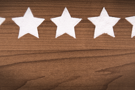 Star rating for product quality on cooking background, top view.の写真素材