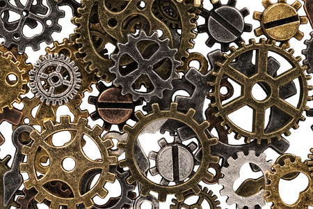Set of metal gears and cogs gear isolated on a white background. Macro.