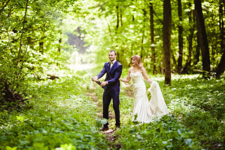 Bride and groom in the spring forestの写真素材