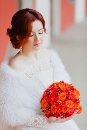 Bride portrait in the gallery with the bridal bouquetの写真素材