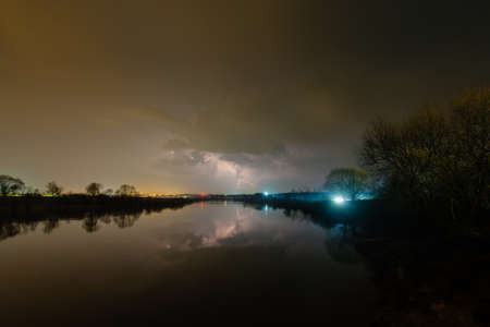 Rain and lightning above the river
