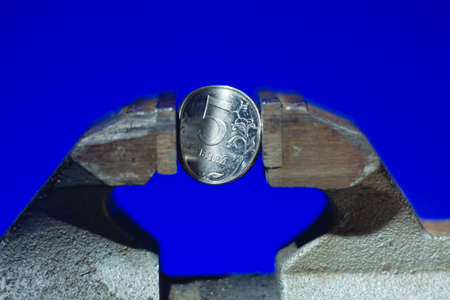 The Russian coin in vise