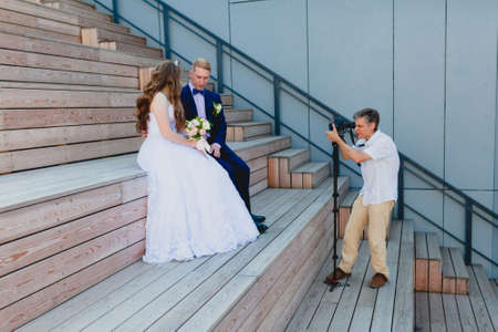Videographer with Groom and Brideの写真素材
