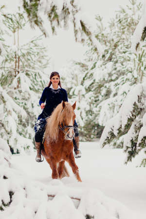 Pretty young model riding the horseの写真素材