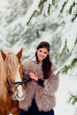 Beautiful young model with the horseの写真素材