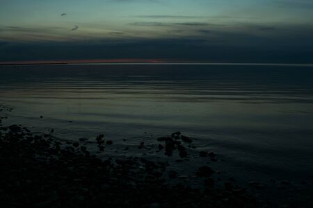thunderclouds in the evening sky near the seaの写真素材