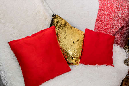 Christmas and New Year pillows on a sofa in a photo studio. Idea for holiday like Christmas and New year, for covers books, magazines, articles.の写真素材