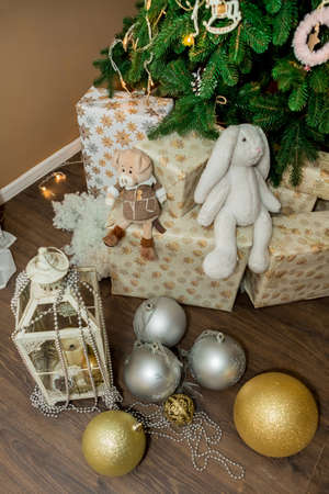 Christmas and New Year tree, toys, and brown wall (3). Idea for holiday like Christmas and New year, for covers books, magazines, articles.の写真素材