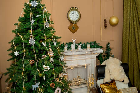 Christmas and New Year interior of a photo studio, and a clock on a brown wall (2). Idea for holiday like Christmas and New year, for covers books, magazines, articles.の写真素材