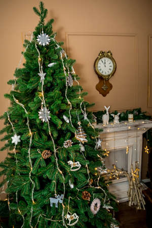 Christmas and New Year interior of a photo studio, and a clock on a brown wall (1). Idea for holiday like Christmas and New year, for covers books, magazines, articles.の写真素材