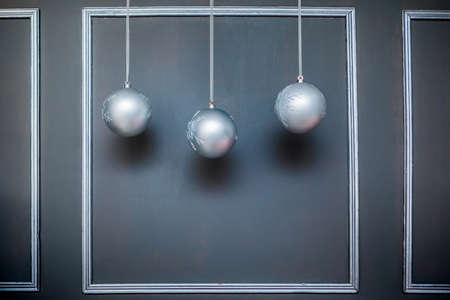 Christmas and New Year photo studio, balls on a gray wall (1). Idea for holiday like Christmas and New year, for covers books, magazines, articles.の写真素材
