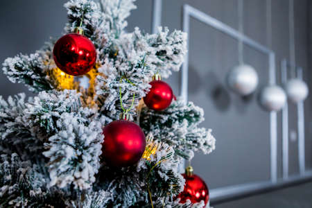 Christmas and New Year photo studio, tree, garlands, balls on a gray wall (3). Idea for holiday like Christmas and New year, for covers books, magazines, articles.の写真素材