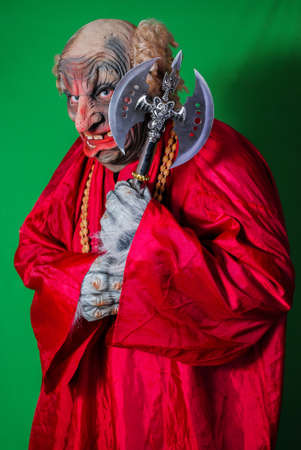 Evil Gnome with a two-handed ax (3). Idea for covers of books and magazines, for commercial ads and articles.の写真素材