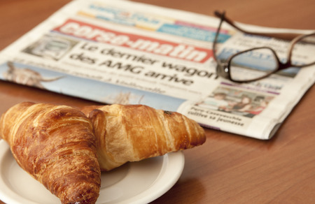 two croissant and a newspaper in corsica