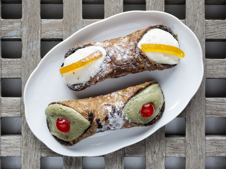 Typical Sicilian sweet called cannoli or "cannolo siciliano"の写真素材