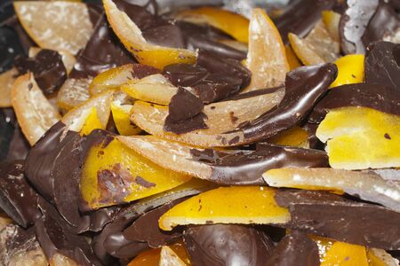 typical italian sweet: fruit with chocolate, peel of oranges with chocolateの写真素材