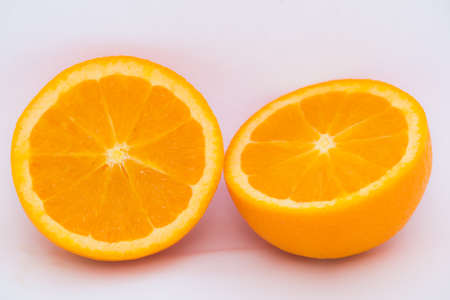 Juicy Mandarin orange, cut in halfの写真素材