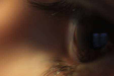 very close Zoom in of a mans eye - like a fly thru