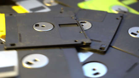 pile of old style data transfer floppy discs, rotating spinning backgroundの写真素材