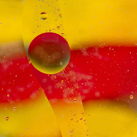 abstract background created reflexes color patches of oil on the waterの写真素材