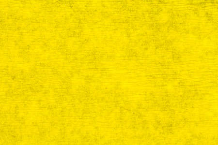 macro detail of yellow crepe paper folded in soft lighting
