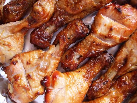 Yammy roased chicken legs, ready to be eatenの写真素材